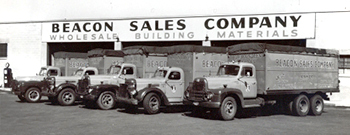 Historical photo of Beacon and a fleet of trucks